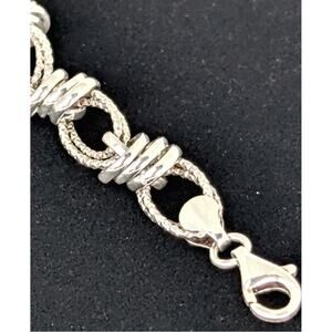 SS chain bracelet 63/4" lobster clasp textured ovals links and connector  NWT